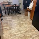 New plank flooring installation in dining area